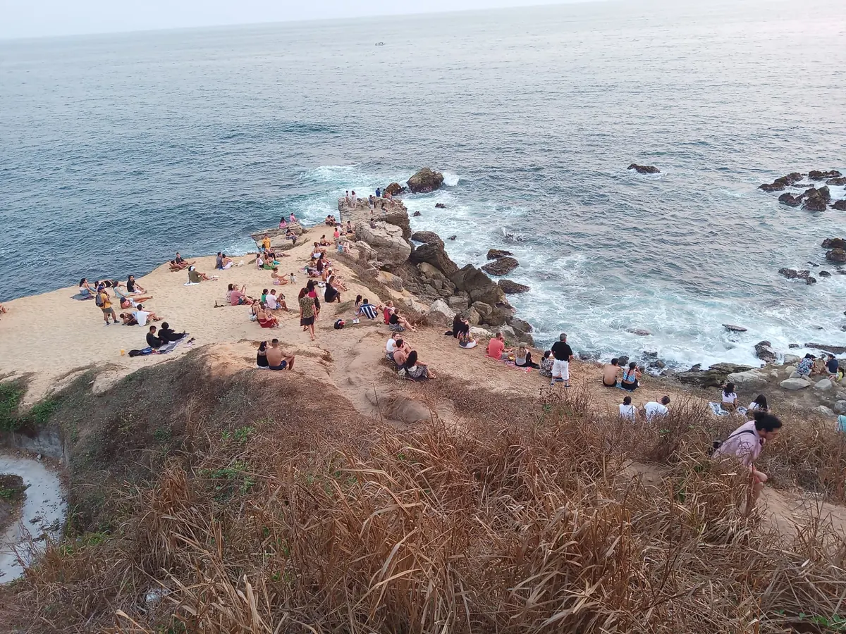 Crowds gathered on the rocky point at Puerto Escondido for the evening sunset